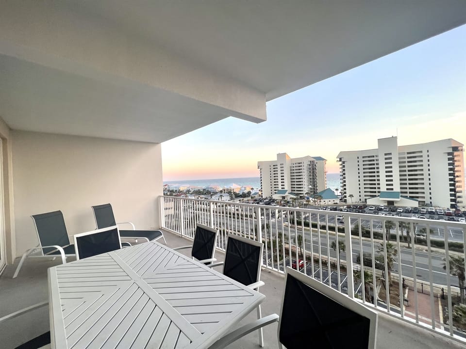 Balcony has 2 loungers, table with 6 chairs