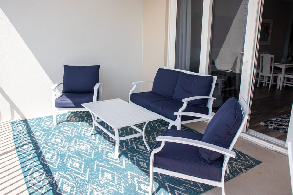 2 chairs and loveseat to enjoy watching the waves roll in.