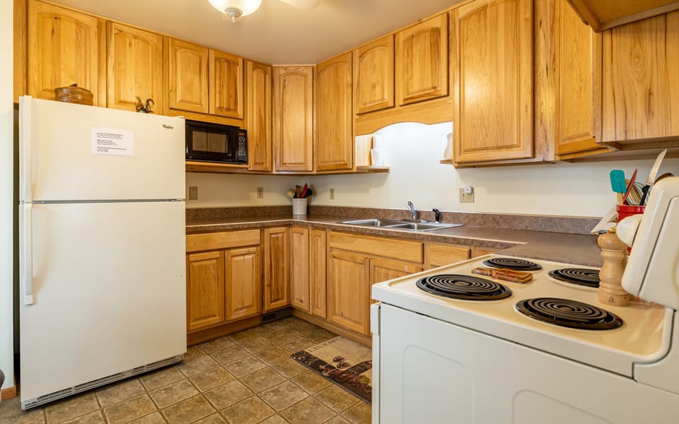 Kitchen with lovely wood cabinets and full size appliances