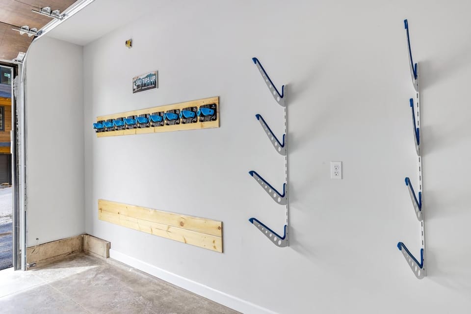 Attached heated one car garage that features tons of ski and snowboard storage and industrial boot warmer system.