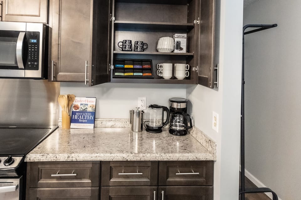 cookbooks, 2 coffee makers, coffee grinder,  teas, what more could one need?
