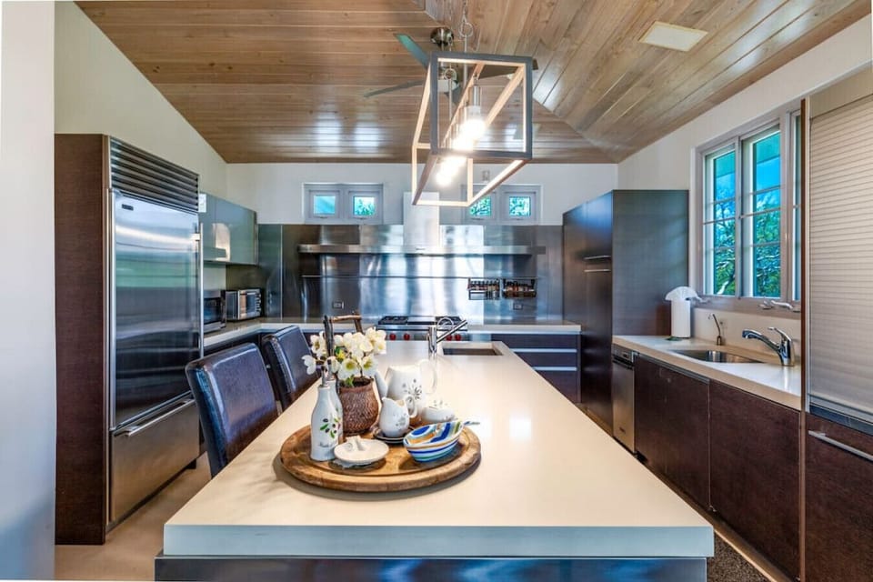 The kitchen island with the kitchen in the background.