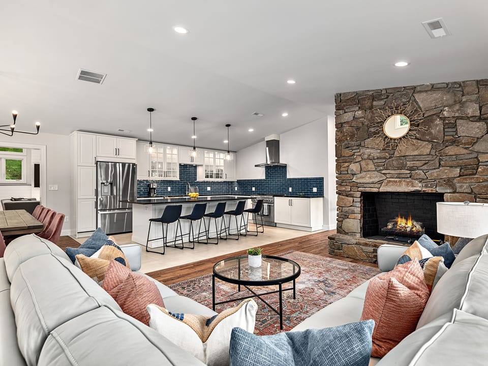 Living room leather sectional with view into kitchen