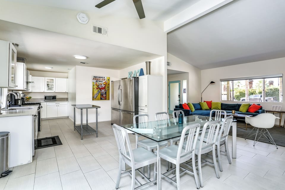 Open kitchen and dining space with stainless appliances