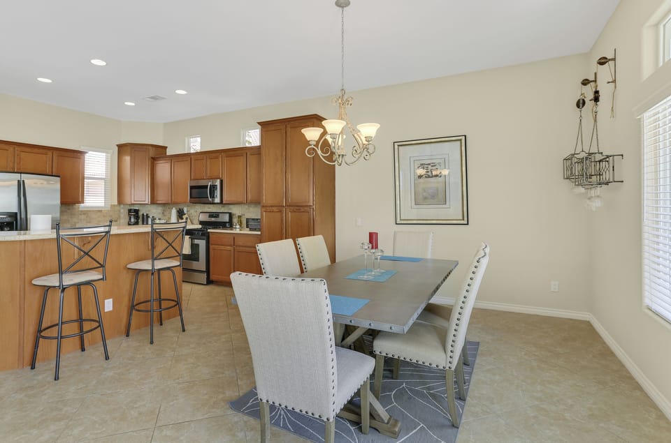 Dining area with seating for six and open kitchen access