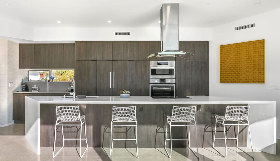 Gourmet kitchen with waterfall island and bar seating