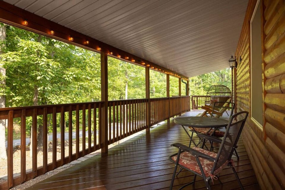 Lots of cozy front porch seating under the string lights