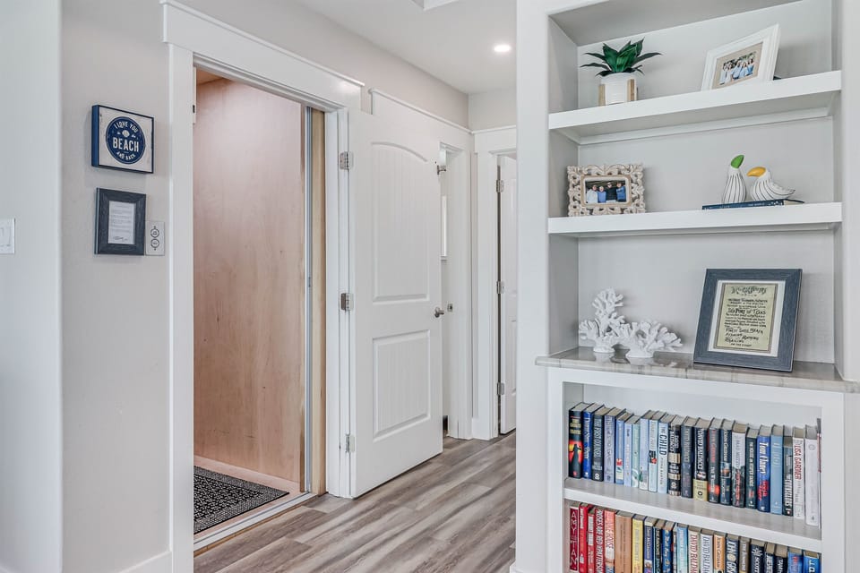 Hallway to bedroom and elevator