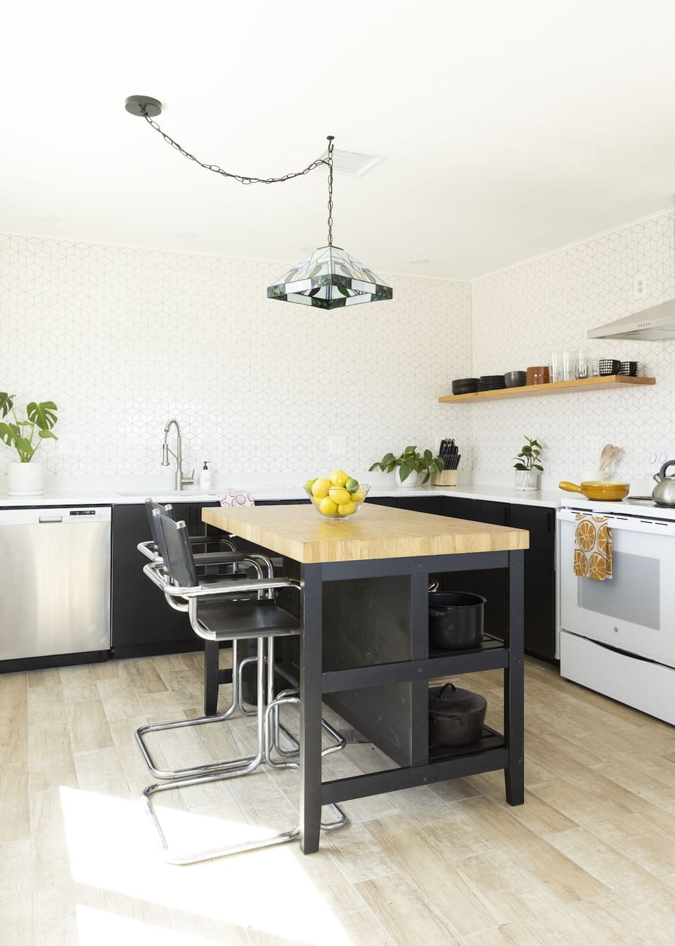 Open concept kitchen with easy access to the dining table + living room