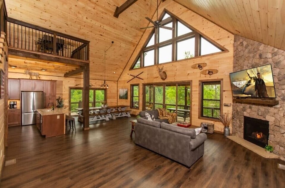 Luxurious Open Concept Floorplan Living Room Area.  Gas Fireplace and Smart TV