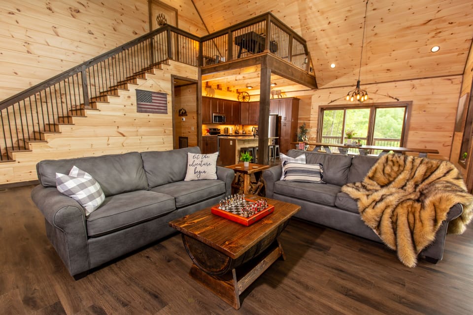 Luxurious Open Concept Floorplan Living Room Area.  Gas Fireplace and Smart TV