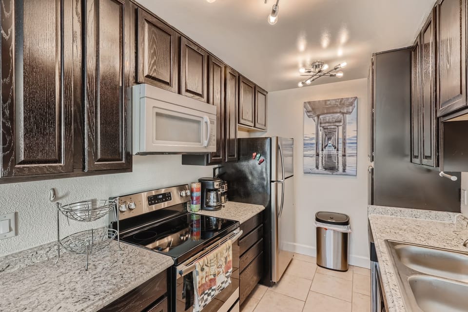 Fully equipped kitchen w/dishwasher, disposal, & cooking & serving dishes.