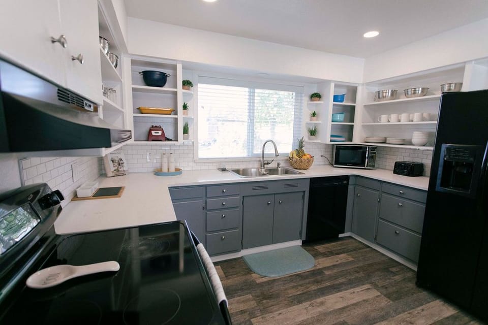 Well lit kitchen, breakfast bar, and coffee/tea bar! 
