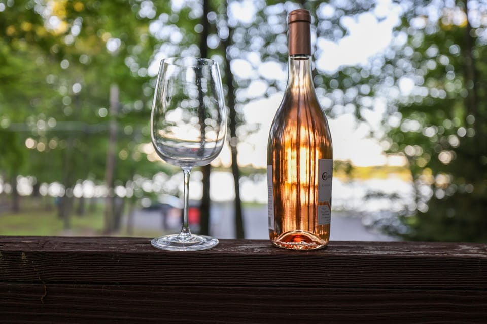 Enjoy the stunning lake view from the beautiful wrap-around deck. The tranquil waters glisten in the sunlight, while the cool breeze rustles the leaves of the trees. Relax and unwind in this idyllic spot, taking in the natural beauty that surrounds you. I