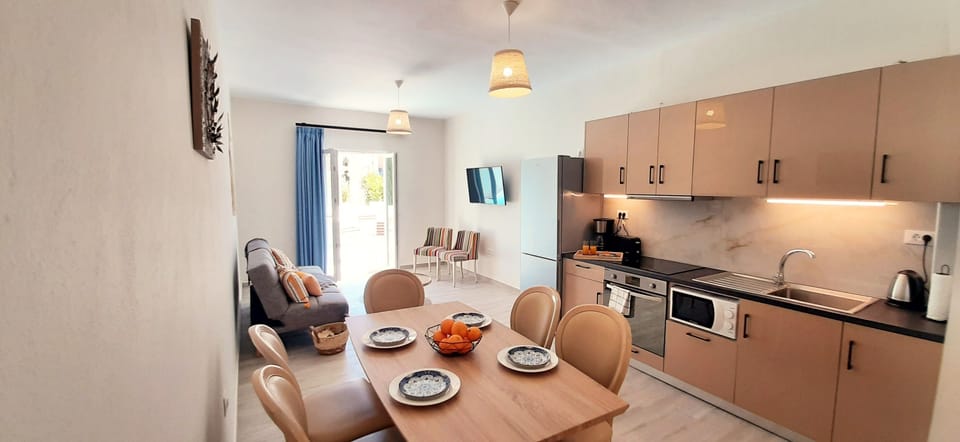 The living and kitchen area with direct pool access.
