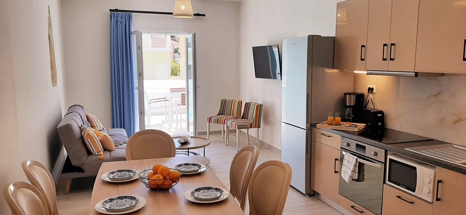 The living and kitchen area with direct pool access.