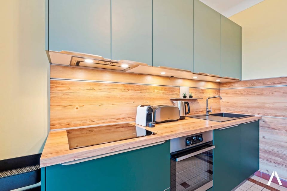 Fully equipped kitchen with modern appliances and smart storage. Ideal for cooking at home, enjoying a quick breakfast, or preparing dinner after exploring the city.