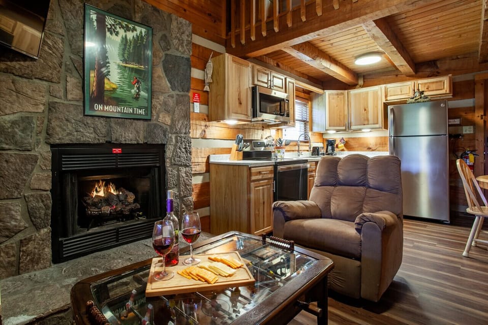 The living room features a gas fireplace and cozy chair!