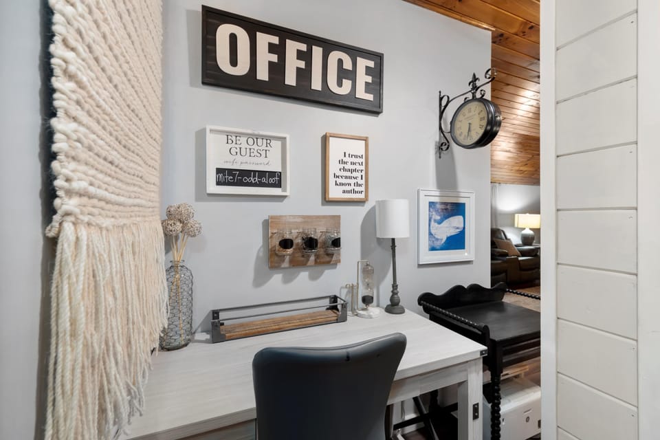 Office area with wireless printer, desk, desk chair
