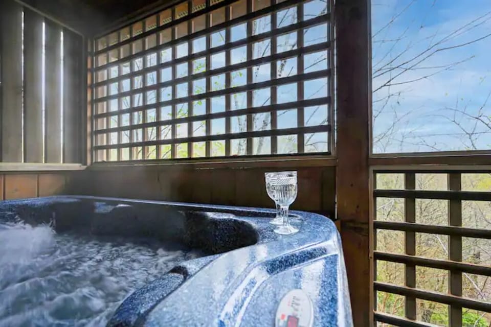 Hot tub in enclosed rear deck.