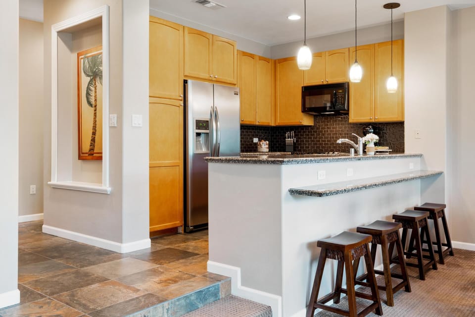 Breakfast bar seating for casual meals or morning coffee.