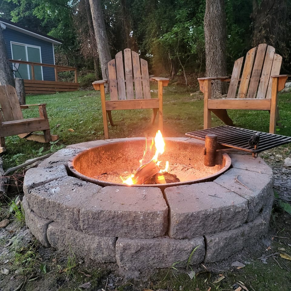 Relax next to the fire or cook your next meal on the built in grill! 