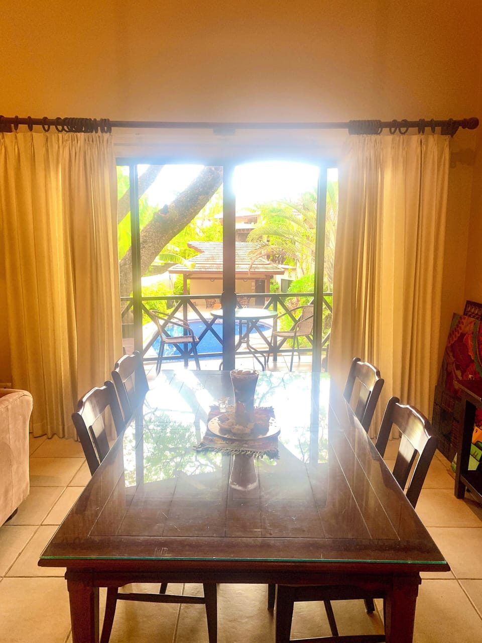 View of pool from dining room table and balcony