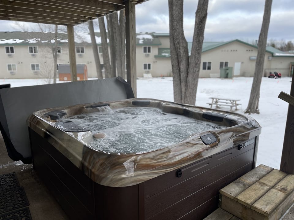 Brand new hot tub with covered deck above