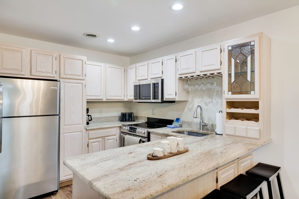 Beautiful Granite counters w lots of storage and cookware