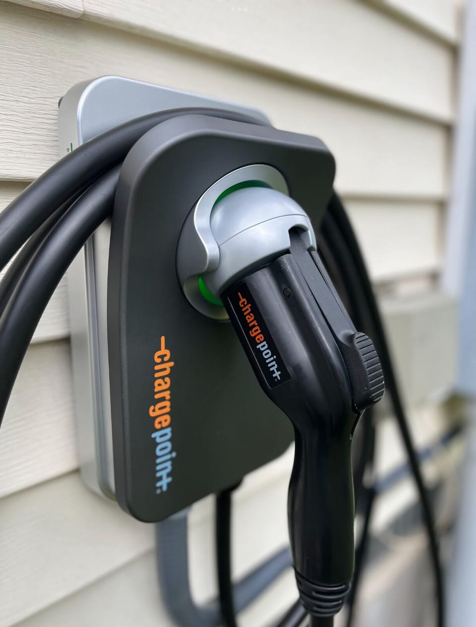 Level 2 EV charger available for guest use, located in the driveway