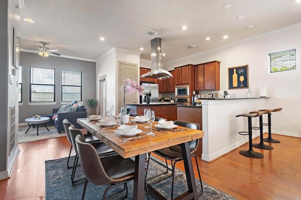 Spacious dining table that sits 6 with full tableware and silverware included.