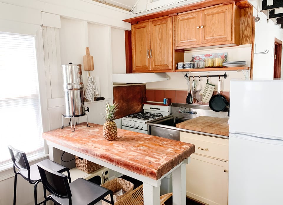 Small kitchen with a Nespresso, coffee maker, water purifier, propane stove