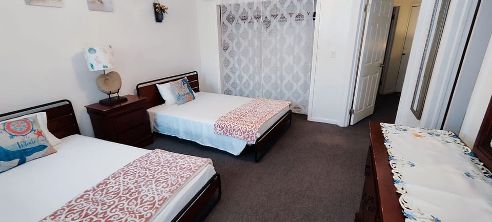 SECOND BEDROOM WITH BALCONY VIEWS