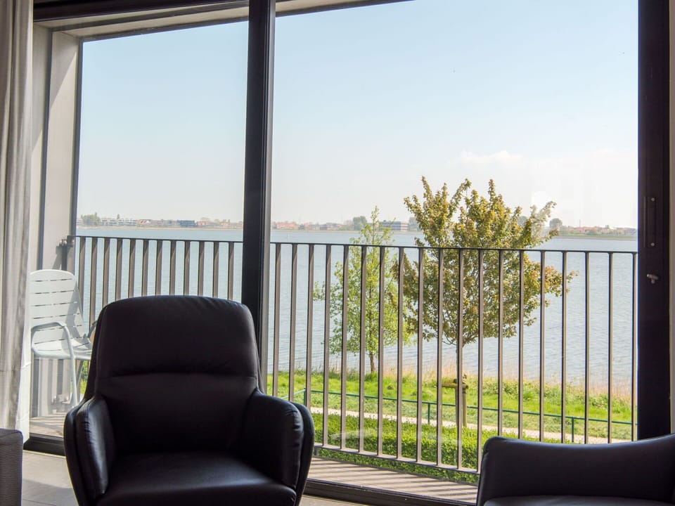 Sky, Property, Furniture, Chair, Window, Shade, Water, Comfort, Interior Design, Fence