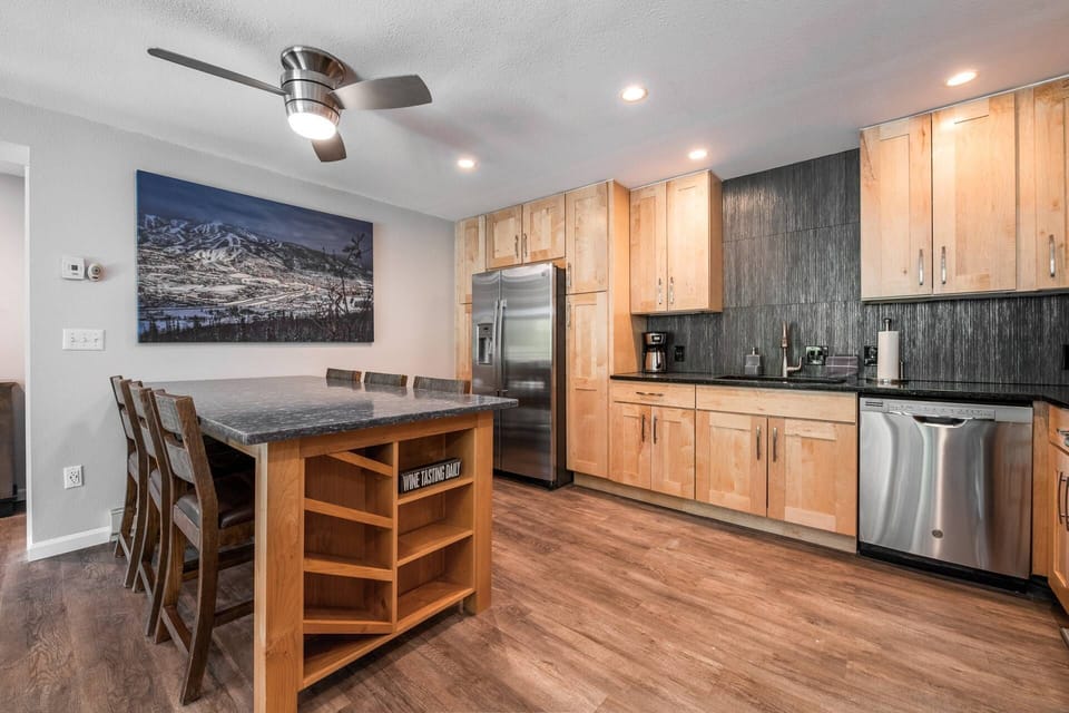 Modern kitchen with plenty of space near dining table—great for meal prep and casual dining!