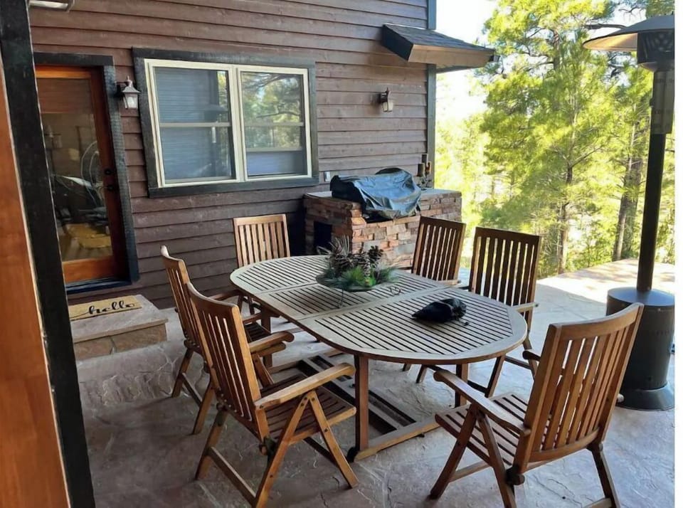 back patio with seating to eat with the view.