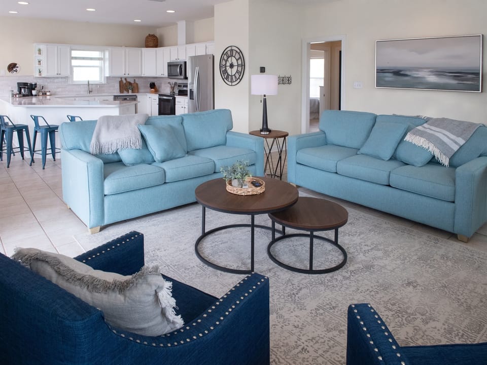 Family room comforts include a brand new queen-size sleeper sofa and an open floor plan
