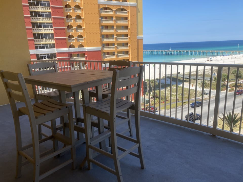 Balcony with table and view of gulf
