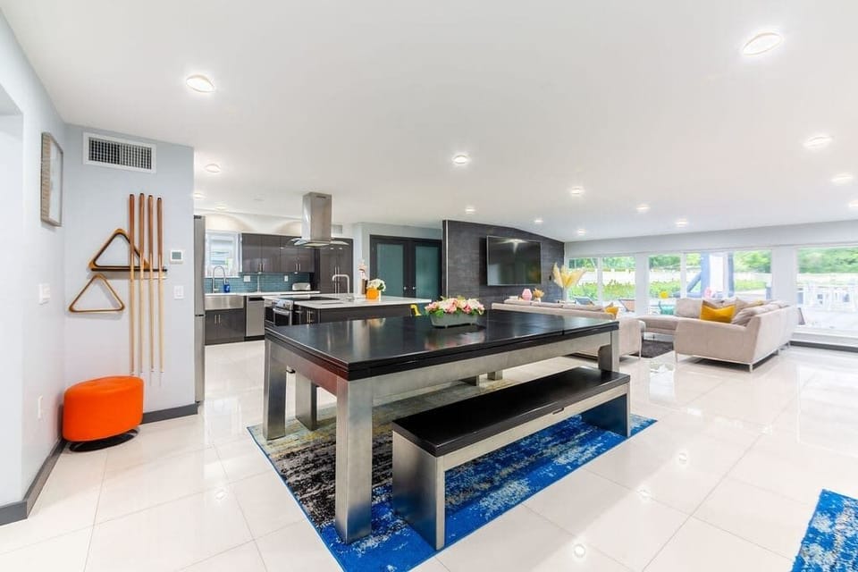 The pool table is also a dining table.