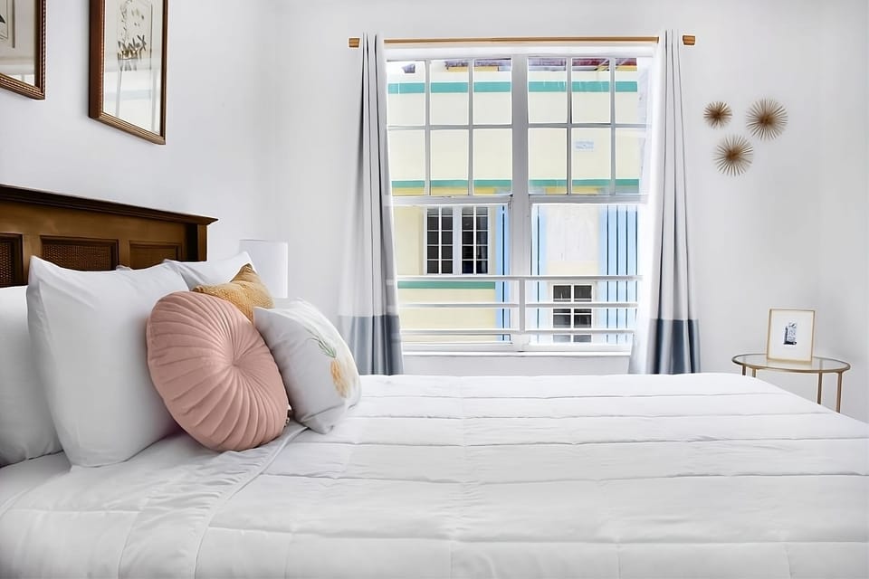 Drift off in a bright room framed by gentle curtains.