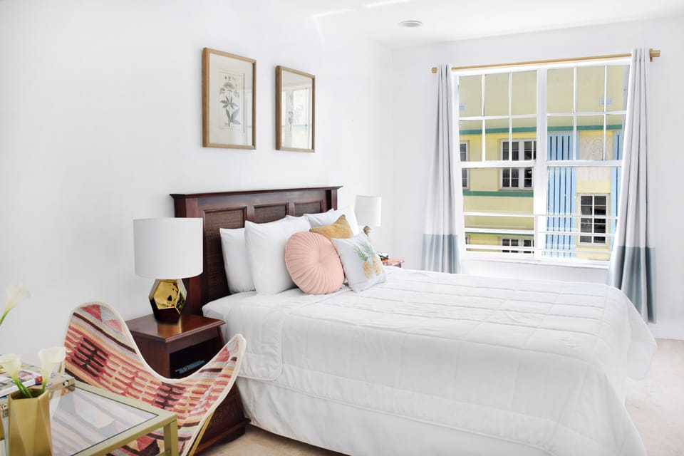 Relax into bright, airy comfort with plush pillows and calm decor.