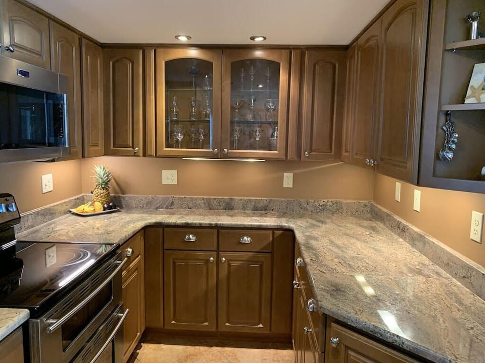 Renovated kitchen with double oven, microwave, huge refrigerator and dishwasher.