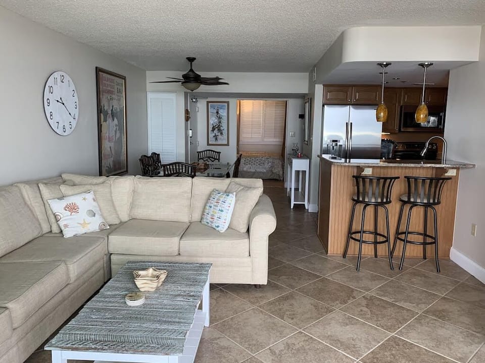 Queen size sleeper sofa in Living Room. Open layout with bar seating for 2!