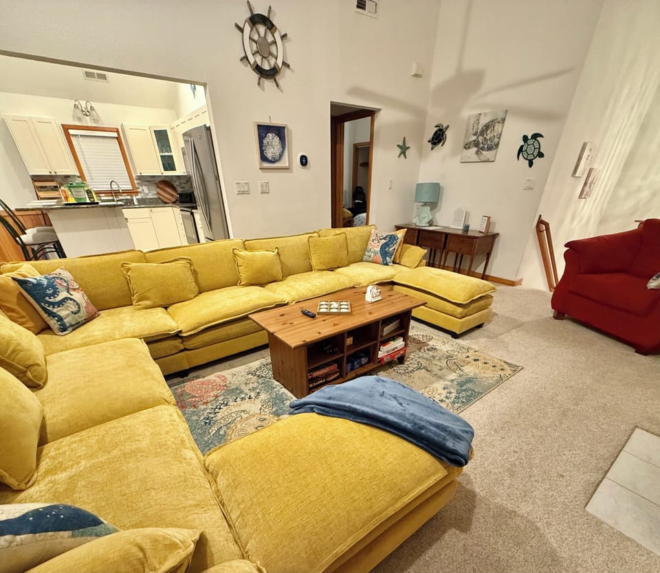 Top floor great room near kitchen has enough room for everyone to watch a movie