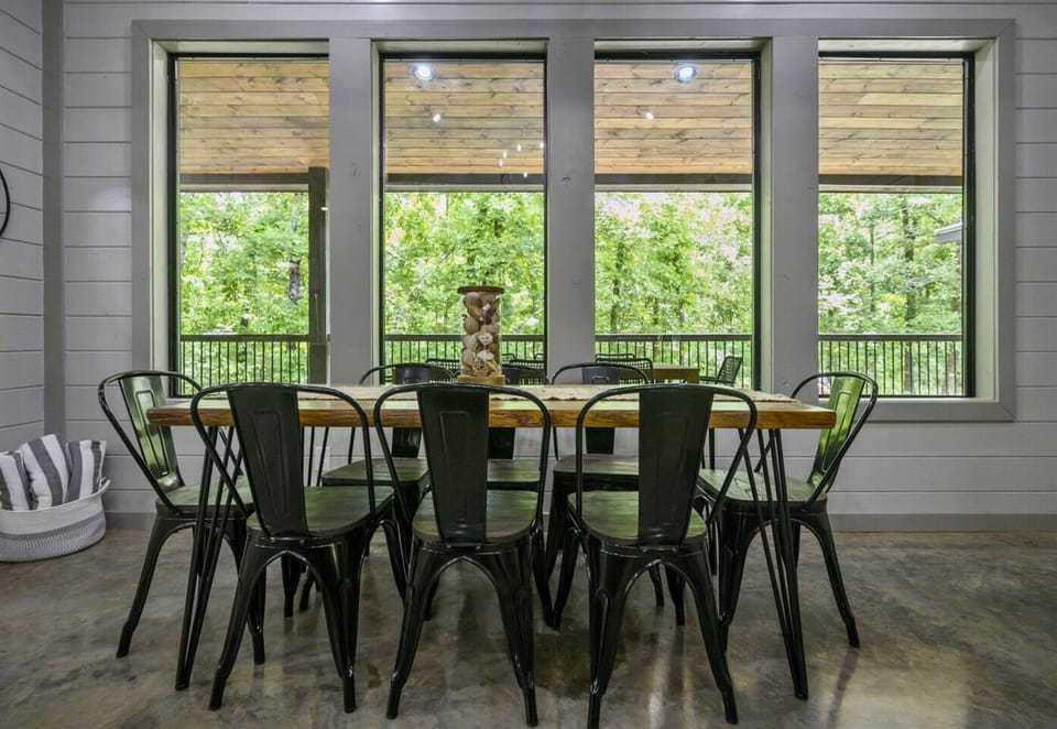 Share meals and stories around our spacious dining table, framed by tranquil views of the great outdoors."