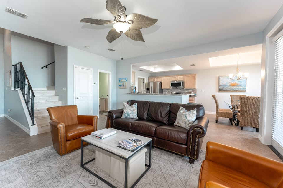 Living room looking into kitchen and dining area