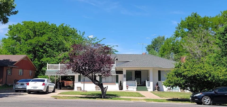 Plenty of parking! 4 car driveway, 1 covered, 2 garage spaces behind home