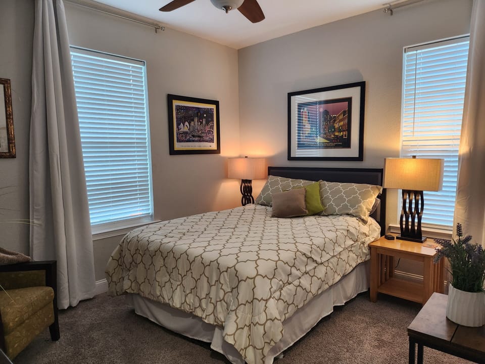 Bedroom 3: Queen bed with wall-mounted flat-screen TV