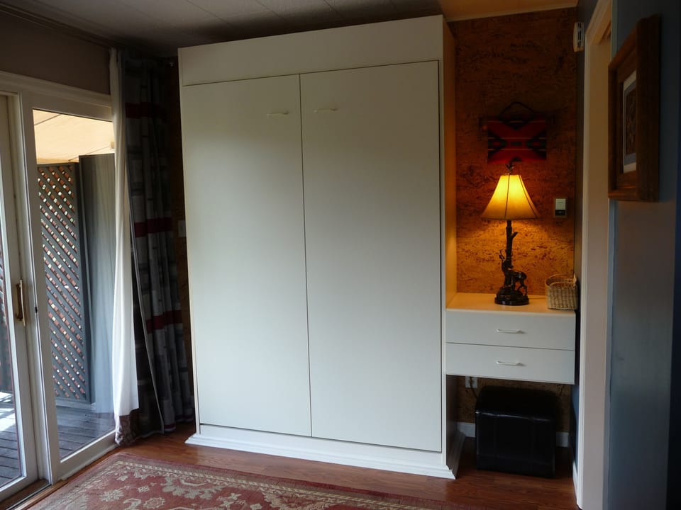 Murphy bed pulls down for an additional full-size bed
