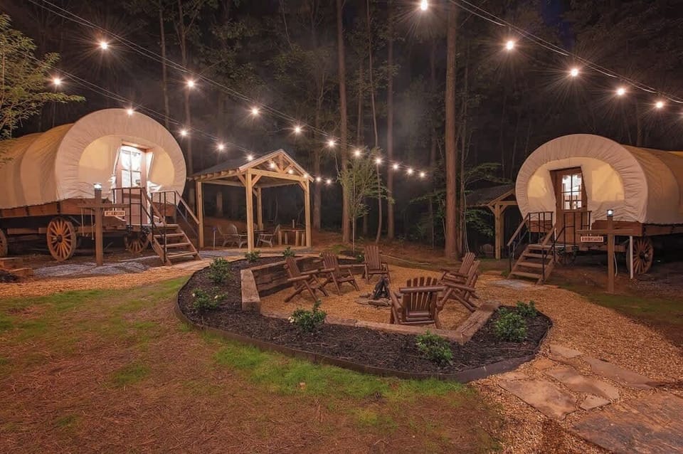 Our 3 Glamping Wagons are corralled around a community fire pit.